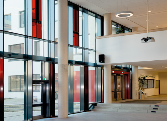  school auditorium is enhanced with colourful highlights and an original lighting concept
